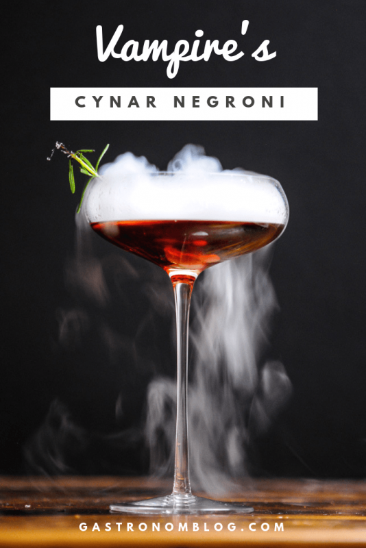 red Cocktail in a cocktail coupe with dry ice fog