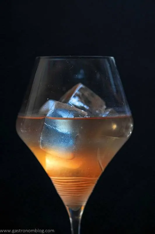 A close up of the Honey Bourbon Pear Cider Cocktail, which features Barenjager Honey and Bourbon, served on the rocks.