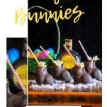 Hollow chocolate bunnies filled with a cocktail, straws and flowers