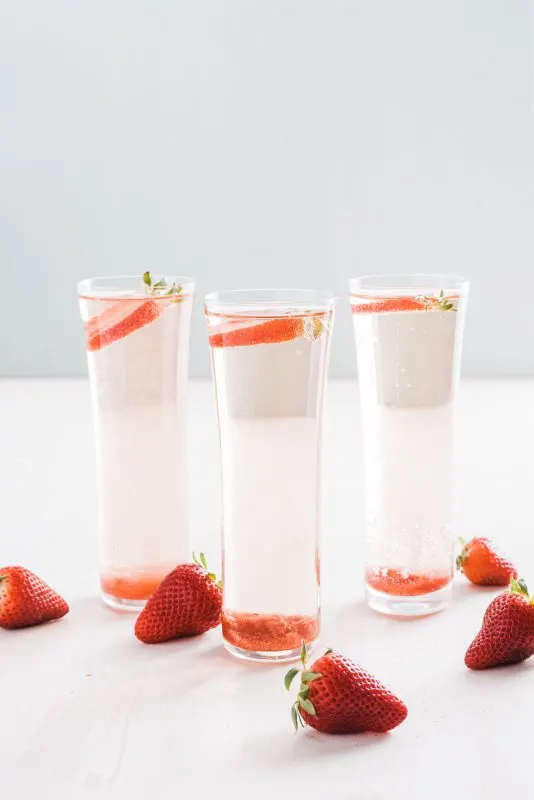 3 cocktails semi clear with strawberries