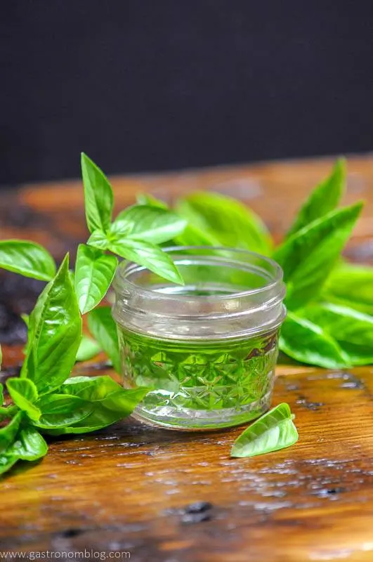 Syrup in jar, basil sprigs