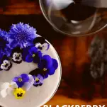 Top view of an egg white cocktail with edible flowers