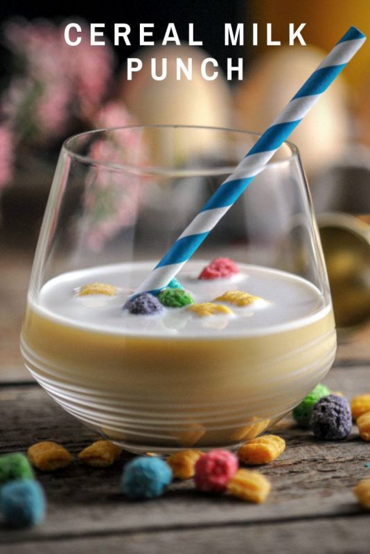 Milk cocktail in glass with cereal and straw