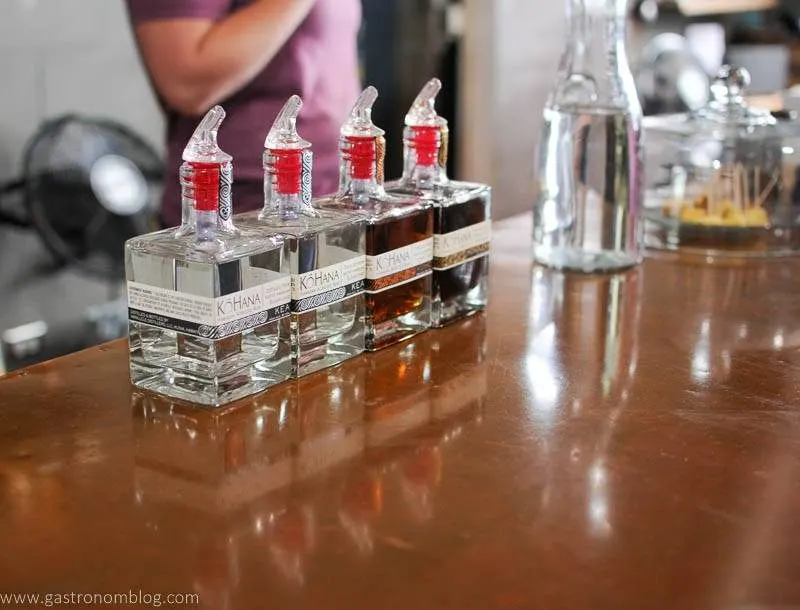 4 rum bottles on bar