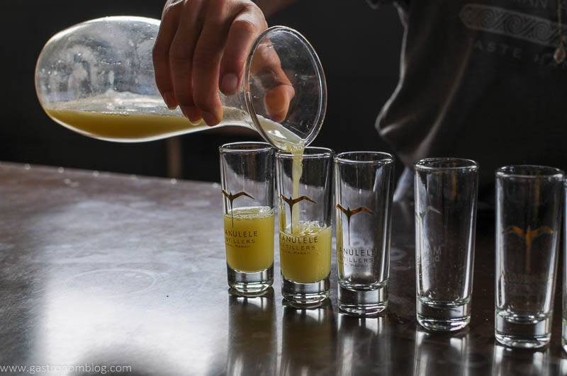 sugarcane juice being poured into glasses