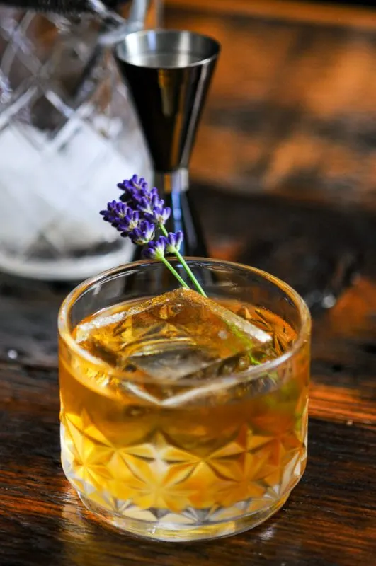 Whiskey cocktail in rocks glass with clear ice