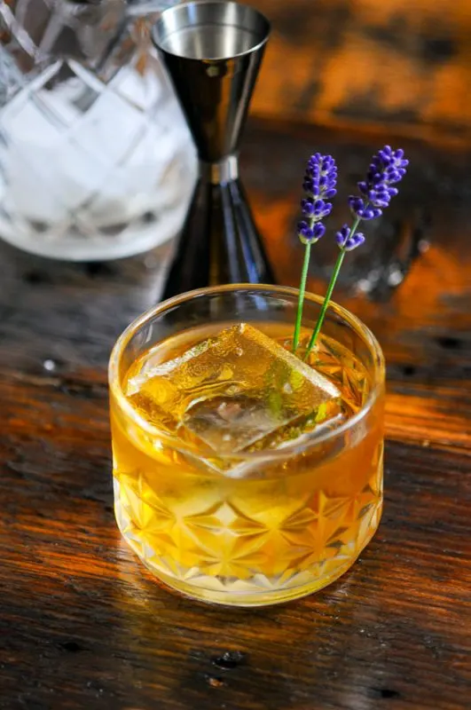 whiskey cocktail in rocks glass with clear ice