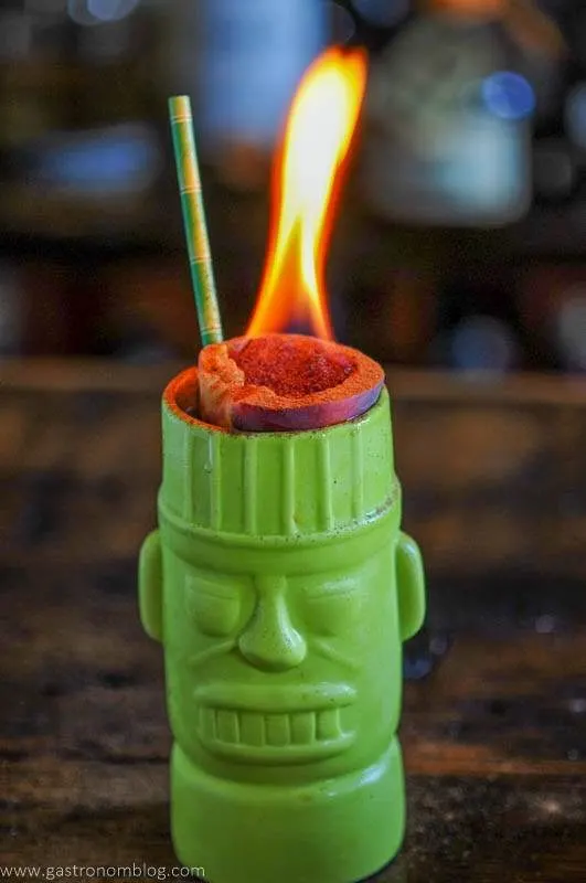 Green tiki mug with zombie cocktail recipe