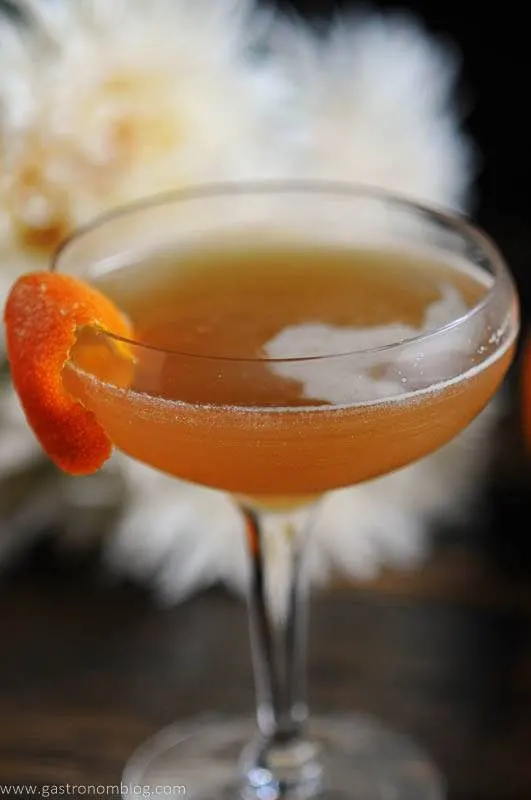 cocktail in coupe with orange peel garnish