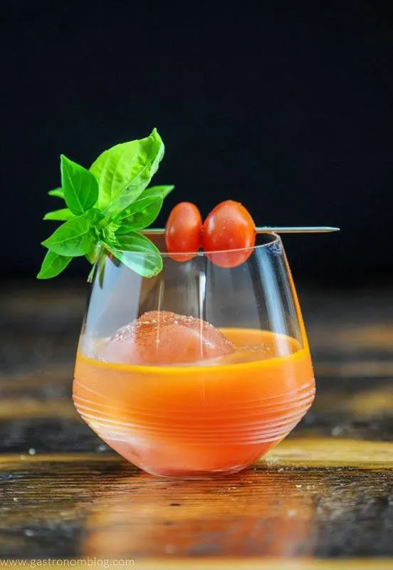Orange cocktail with Dorothy Lynch base, tomatoes, basil