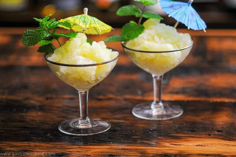 Yellow frozen dessert with pineapple and mint