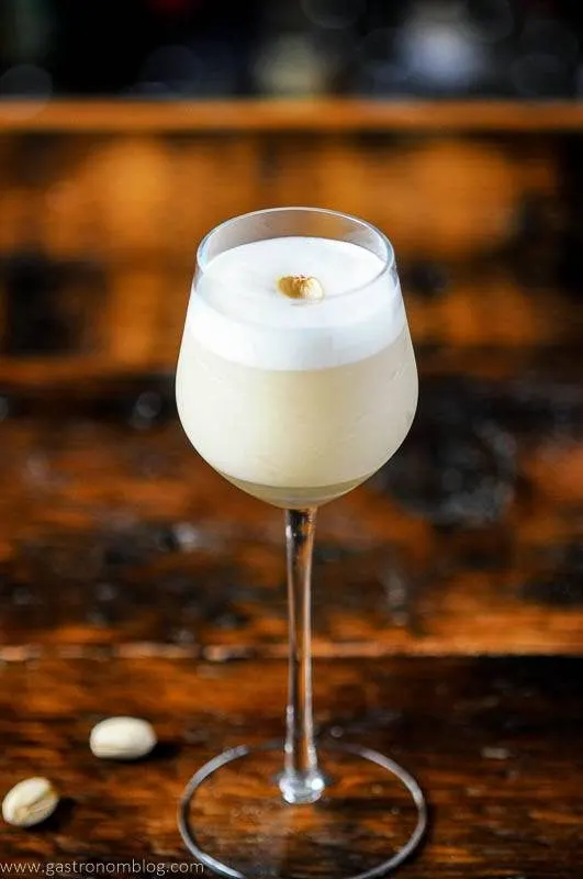 Creamy cocktail in tall glass