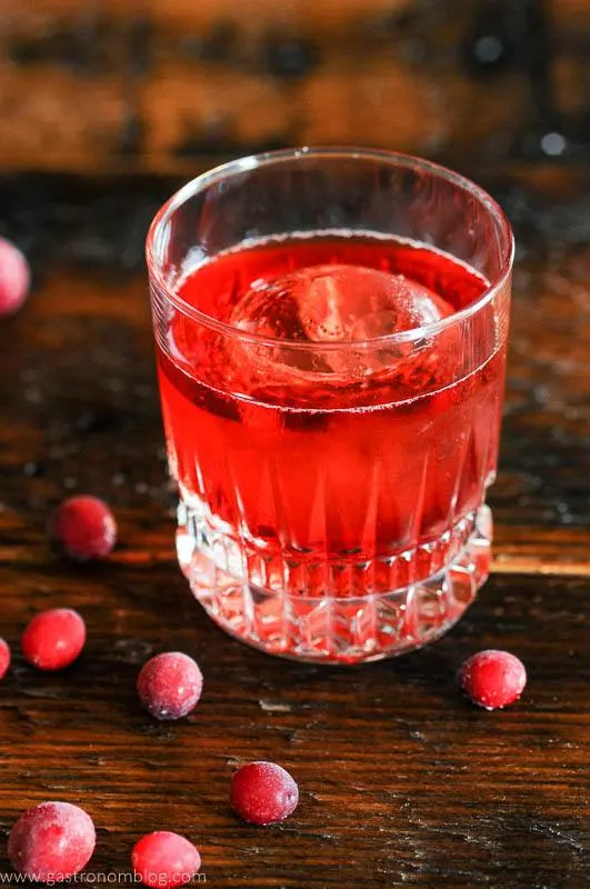 Top shot of red cocktail and cranberries