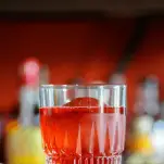 Red cocktail with cranberries