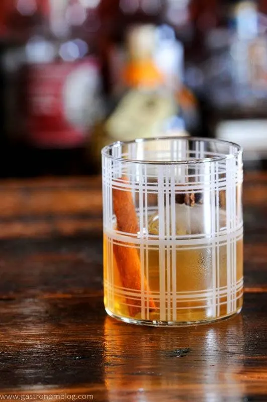 Plaid glass with brown spiced old fashioned, cinnamon stick