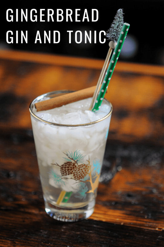 Cocktail in winter glass, green straw, cinnamon stick