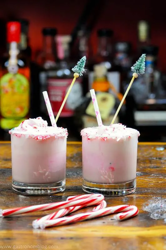 Pink cocktails in glasses, candy canes