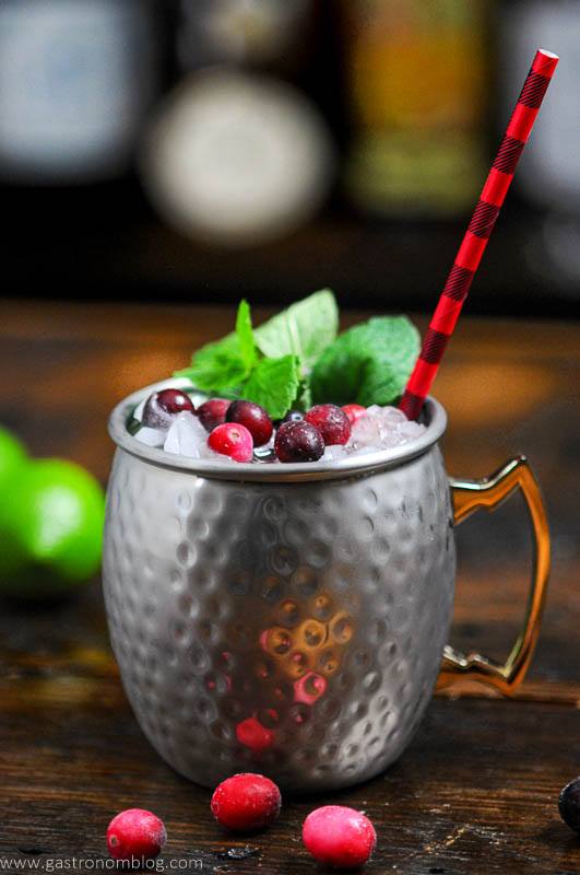 Cranberry Drink in silver mug, mint, cranberries and red black straw
