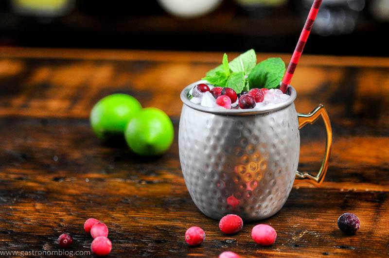 Cranberry Mocktail in silver mug, black and red straw, mint
