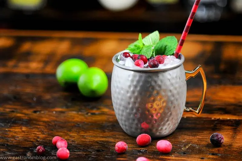 Cranberry Mocktail in silver mug, black and red straw, mint