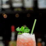 Pink cocktail in glass with mint