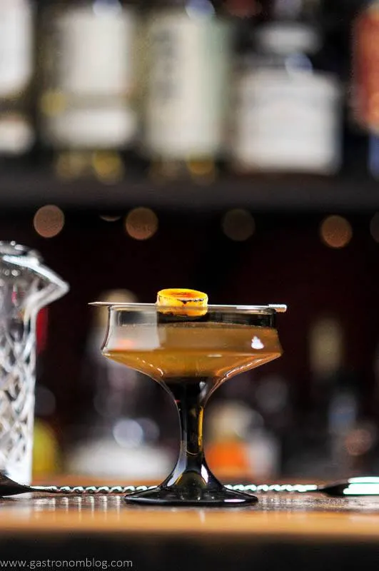 Peanut Butter Cocktail in brown glass with banana slice