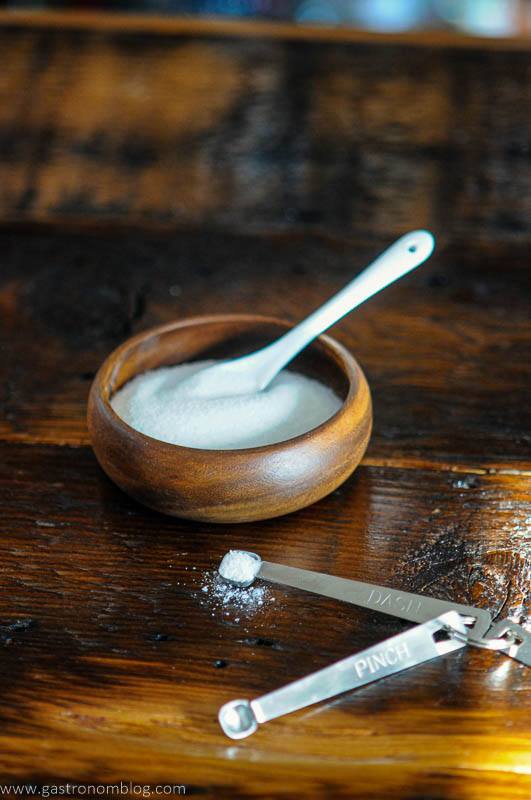 Wood bowl of sugar, measuing spoons