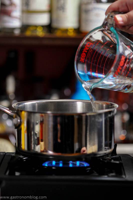 water being poured into a saucepan