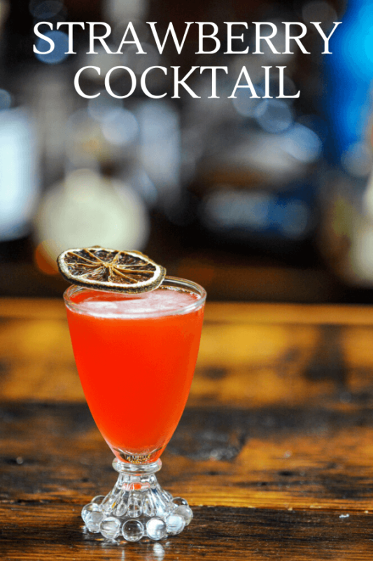 Strawberry cocktail with citrus slice garnish