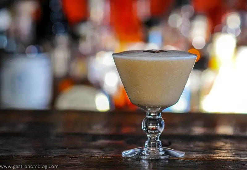 tan Cocktail in glass, white foam