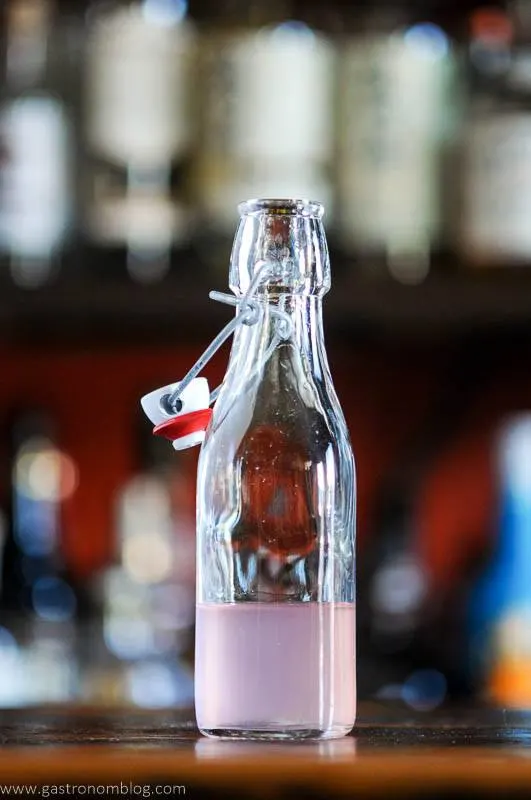 Rhubarb syrup in swingtop glass bottle