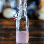 Pink Rhubarb Syrup in glass bottle
