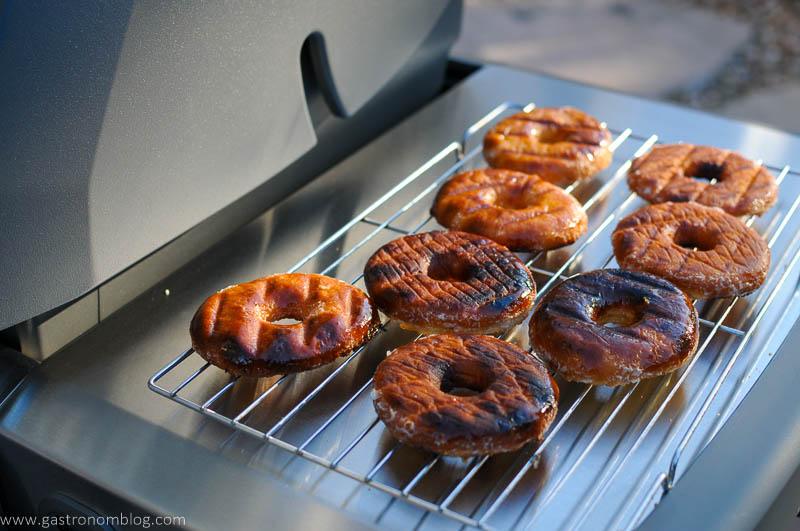 Grilled Donuts on cooling rack on grill