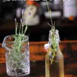 Syrup in bottle, lavender sprigs in mixing glass