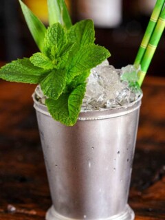 Silver cup with crushed ice and pineapple fronts and mint