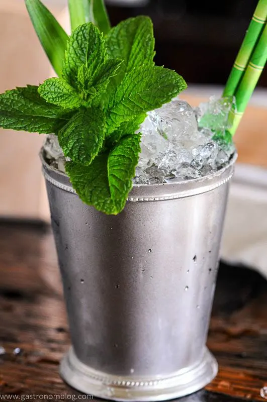 Silver cup with crushed ice and pineapple fronts and mint