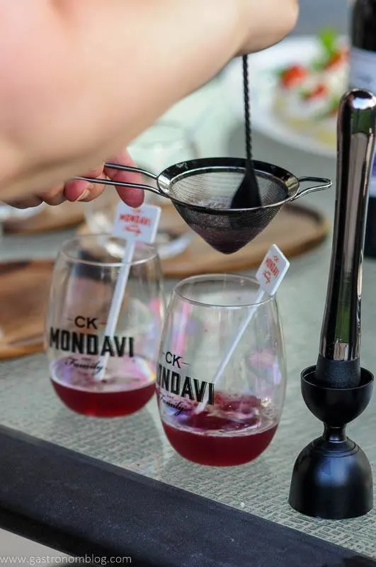 Red wine cocktail recipes being poured into wine glasses