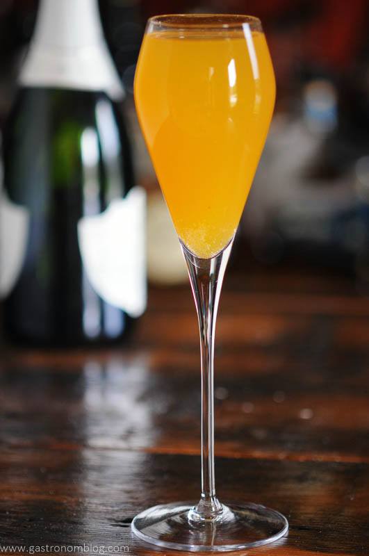 orange cocktail in tall glass