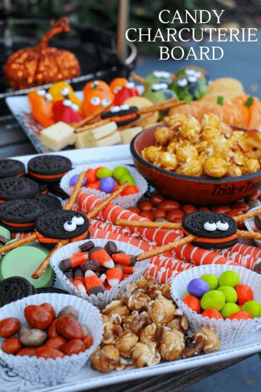 Halloween Charcuterie on plates with Halloween candy and healthy treats