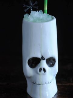 Key Lime Colada cocktail in a skull tiki mug