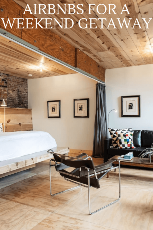 Inside a carriage house Airbnb, wooden ceiling and modern furniture