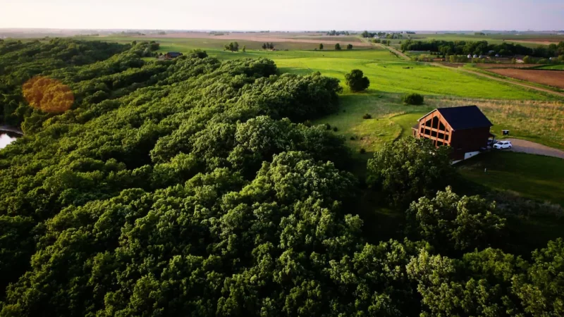house in field, among trees and on the river, one of many unique vacation homes on this list