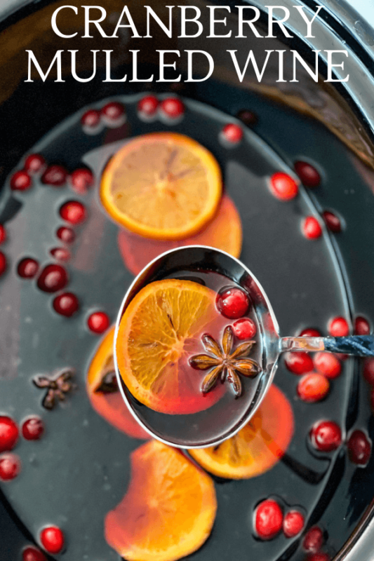 Slow cooker mulled wine with orange slices, cranberries and spices