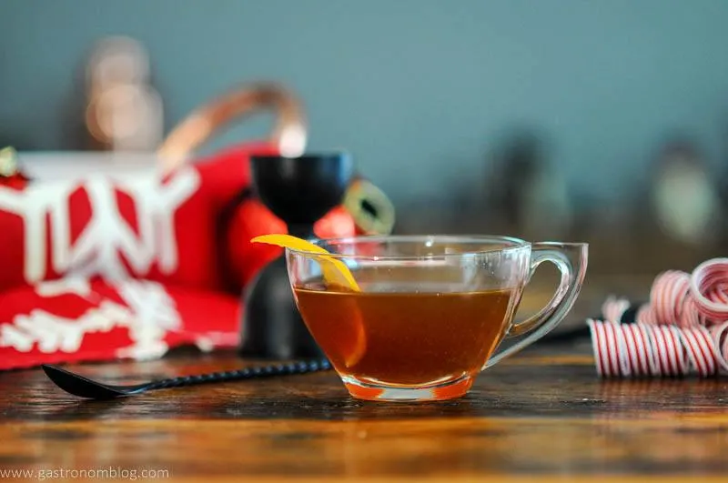 Hot Gin Toddy in tea cup with orange zest