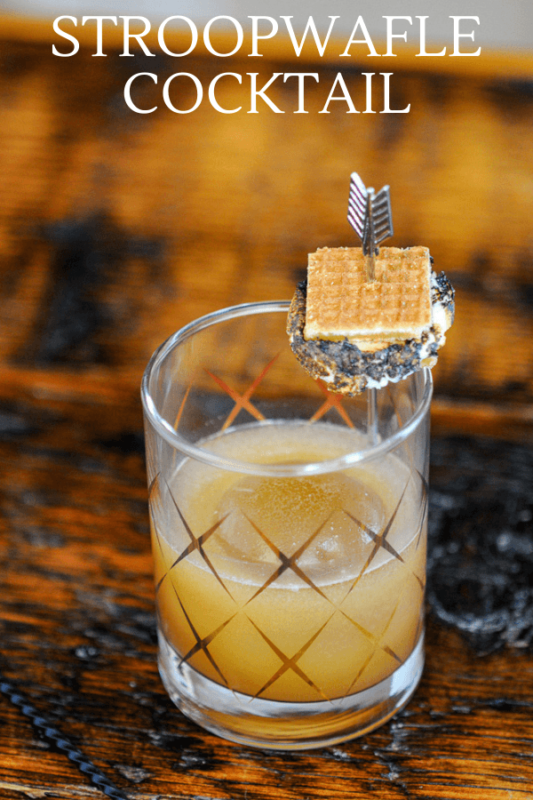 Gold etched glass with cocktail, tiny s'more on garnish pick