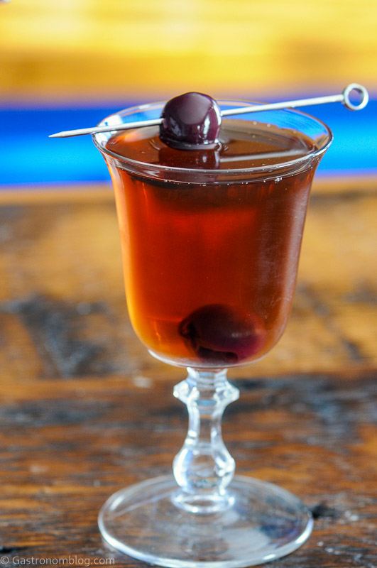 Chocolate Manhattan in a coupe, cherry on pick