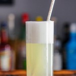 Gin Fizz cocktail recipe in a tall glass with a straw