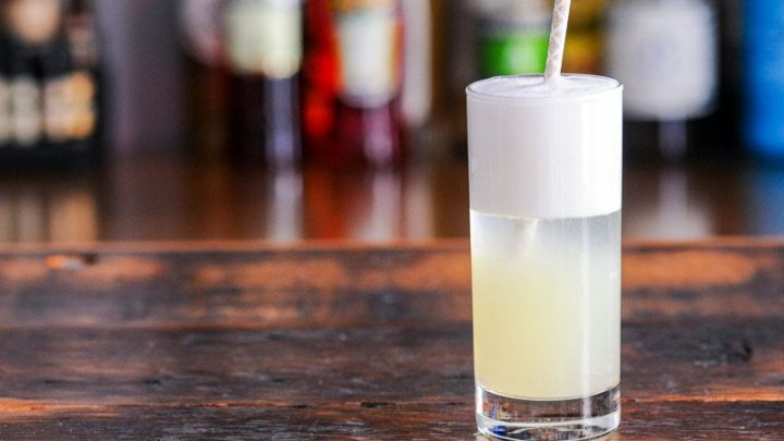 Gin Fizz cocktail recipe in a tall glass with a straw