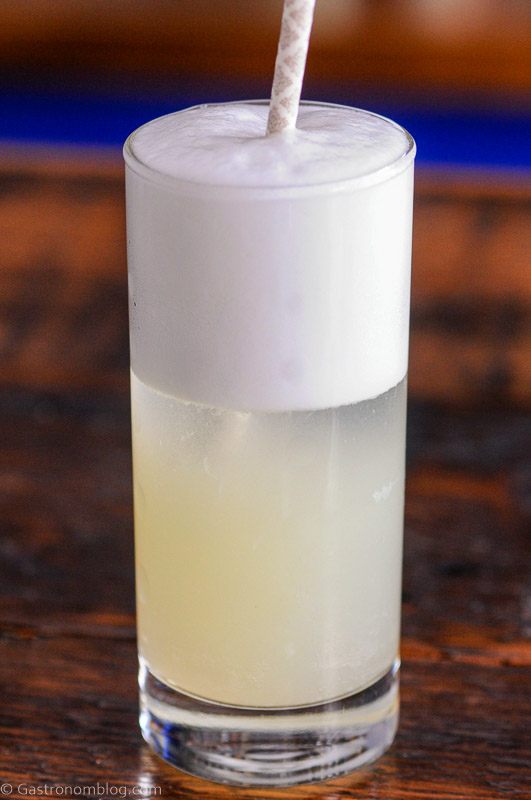 Gin Fizz cocktail recipe in a tall glass with a straw