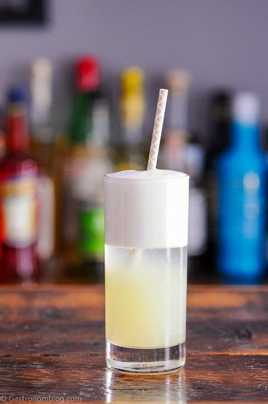 Gin Fizz cocktail recipe in a tall glass with a straw